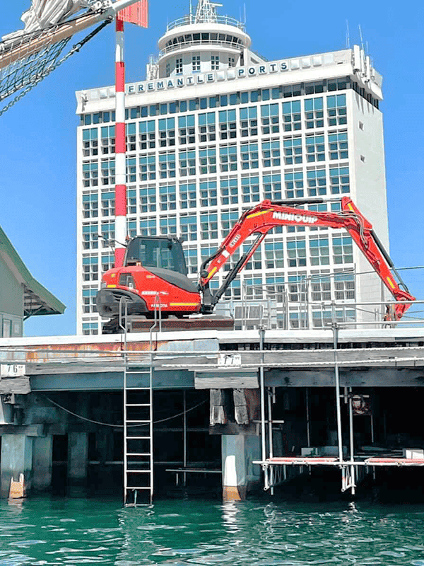 Compact mini excavator for construction and demolition projects, available for hire from Miniquip Hire.